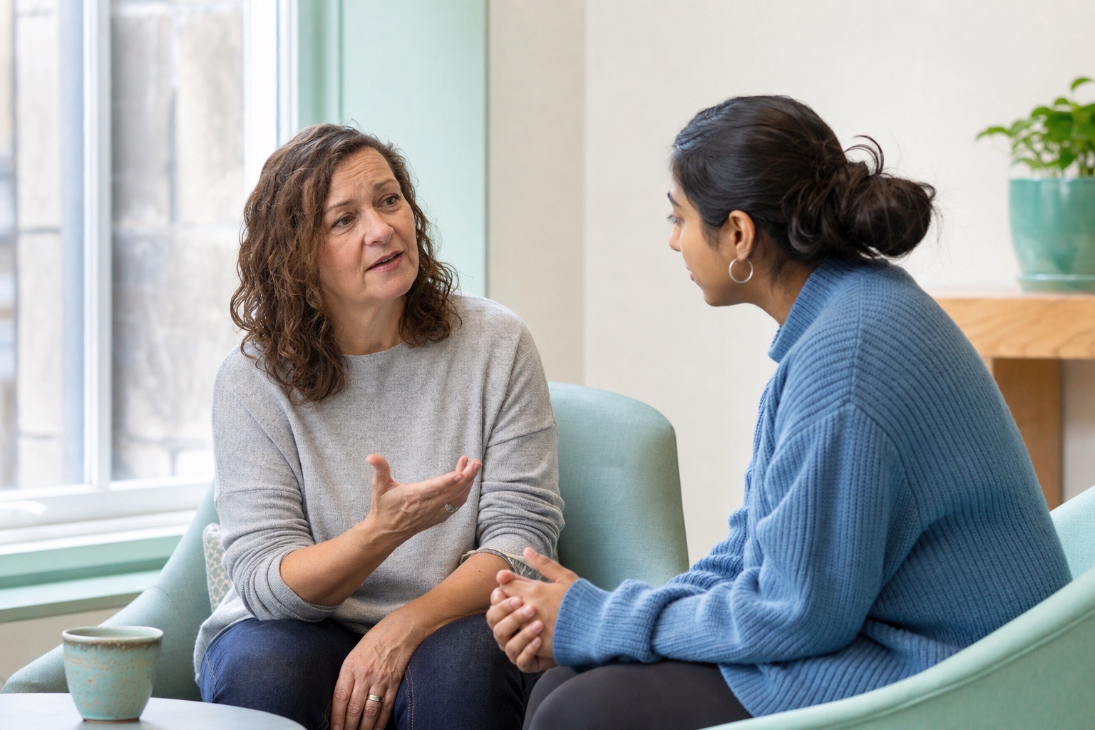 Two people having a calm, supportive conversation